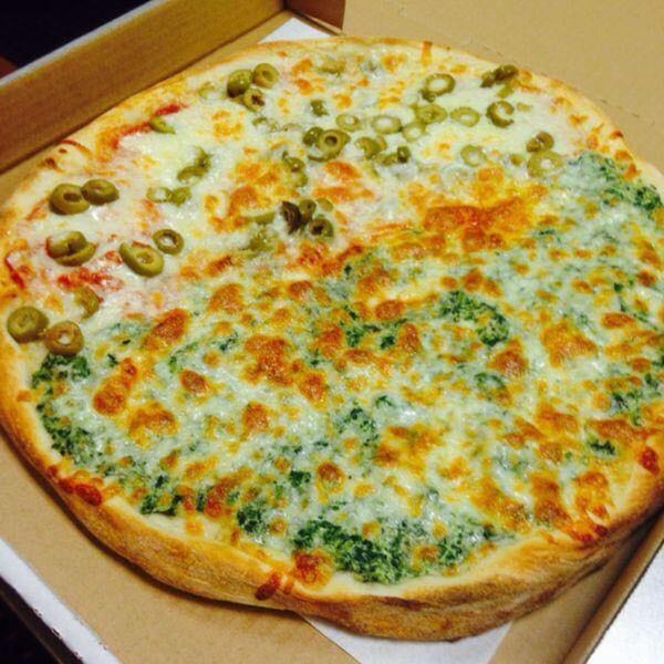 Brami's Kosher Pizza with half green olives and half spinach, in a pizza box.